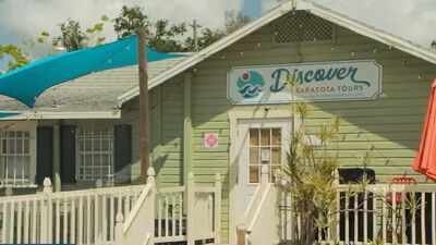 Florida couple’s colorful Sarasota cottage village houses 17 small businesses; a 324-apartment plan threatened demolition, but owners canceled the sale and took the property off market