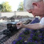An Arizona homebuilder spent years and hundreds of thousands of dollars turning his backyard into one of America’s largest private garden railways, with nearly 4,000 feet of track and hundreds of train cars