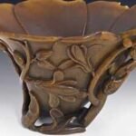 A Sydney shopper bought a carved cup for A at a thrift shop; experts identified it as a centuries-old Chinese rhinoceros-horn cup, and was auctioned for A,640 in 2013