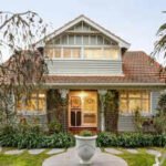 A 1920s Arts and Crafts home in Melbourne’s Alphington heads to auction for .4 million; the historic home comes with Kookaburra stained-glass windows and distinctive architectural features