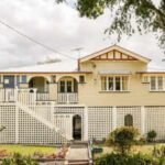 In 1921, a Brisbane man built a family home that stayed with his descendants for 105 years; his 98-year-old daughter has now sold the 810-sq-m property for A .03 million after 10 bidders registered