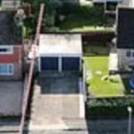 In 2022, a Russian Orthodox priest bought a £470,000 home beside a woman who paid £260,000 for hers; their fight over a one-metre strip of land has led to CCTV, criminal charges and a holy-water blessing at the fence