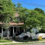 A Connecticut town paid 5,000 for a historic two-family home to create about 20 library parking spaces; a state preservation council has now voted to ask the attorney general to stop its demolition