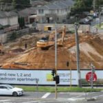 An Australian developer says a rail project halted its 218-apartment build after the state moved to acquire underground land; with more than 100 buyers waiting, it is suing for at least A0 million