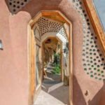 In 2011, a Wyoming couple built a 1,500-sq-ft off-grid home from 1,343 tyres on 55 acres, adding a 66-foot greenhouse, solar panels and rainwater systems; 15 years later, the unusual Earthship is listed for 5,000