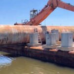 Mississippi sank a 31-ton propane tank and steel tower once used to train firefighters 13 miles offshore, turning old equipment into a long-lasting artificial reef for Gulf fish