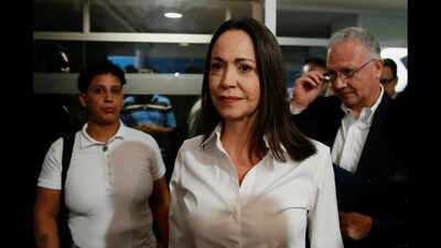 ‘I am here. With you’: Maria Corina Machado returns to Venezuela from exile